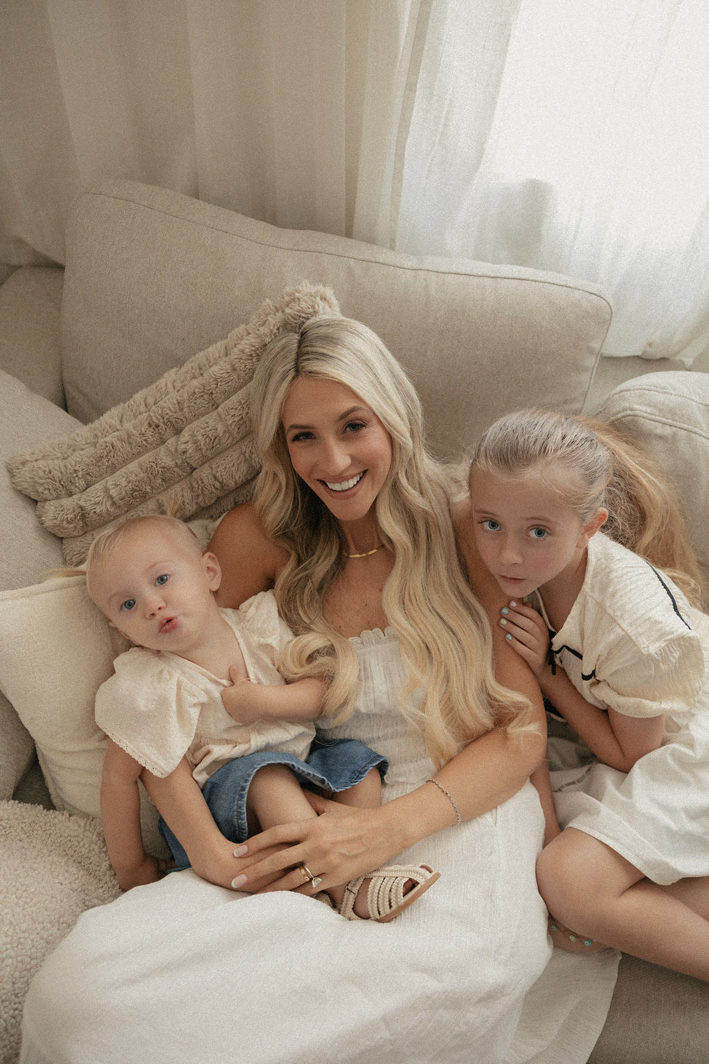 A mother and her two daughters at home